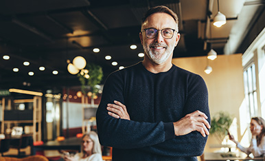 Man wearing black shirt with arms crossed